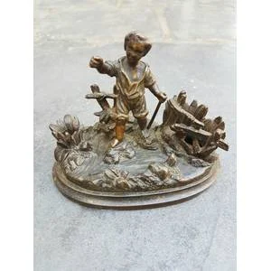 A C1900 Parcel Gilt Bronze Casting of a Child in a Landscape with Vesta Holder and Striker