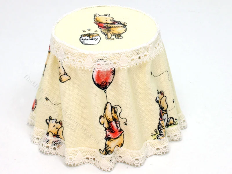 Circle Table with Winnie The Pooh Tablecloth by Judith Blondell